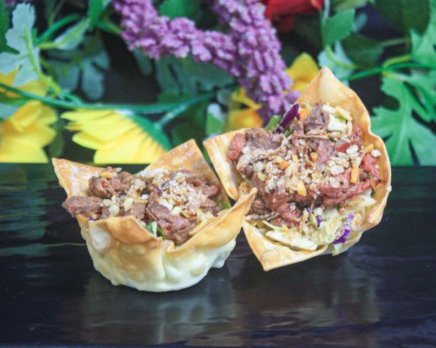 Wonton cup filled with Thai chilli beef, Asian slaw, toasted peanuts