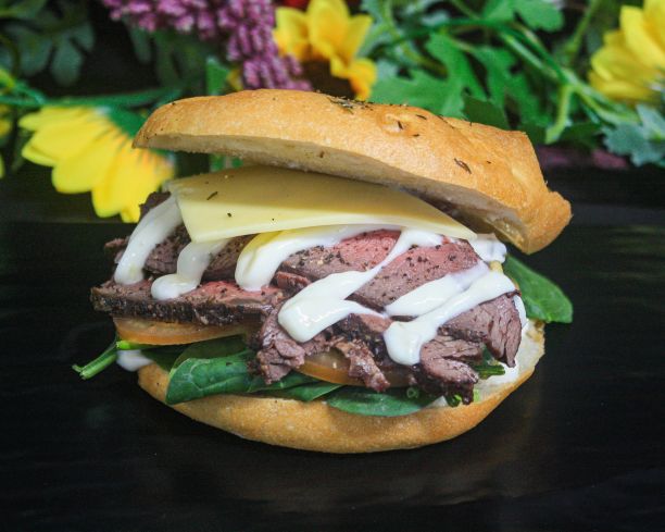 Turkish bap – Peppered beef, Swiss cheese, tomato, baby spinach, pickle mayo