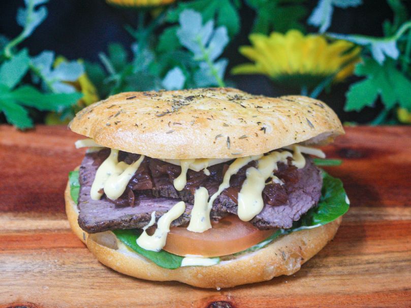 Turkish roll with herb beef, balsamic onion, Swiss cheese, tomato and béarnaise 