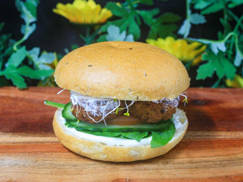 Herb milk bun with falafel, whipped feta, cucumber, tomato and sprouts (v) 