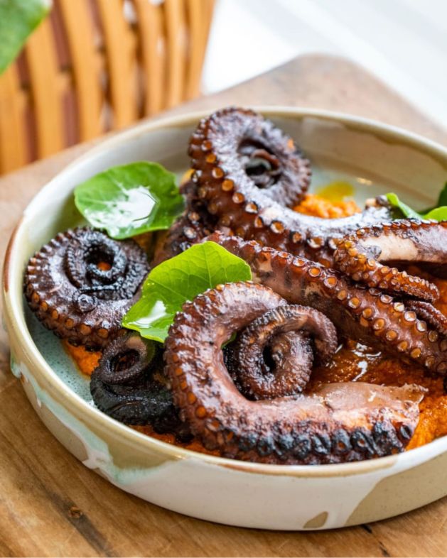 Octopus marinated w Espelette & Oregano, served w Romesco
