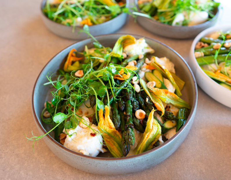 Burrata w asparagus, broad bean, zucchini flower, tarragon dressing & hazelnut Serves 3-4